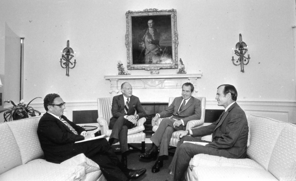 National Security Advisor Henry Kissinger, Secretary of State William Rogers, President Nixon, and Ambassador to the UN George H.W. Bush