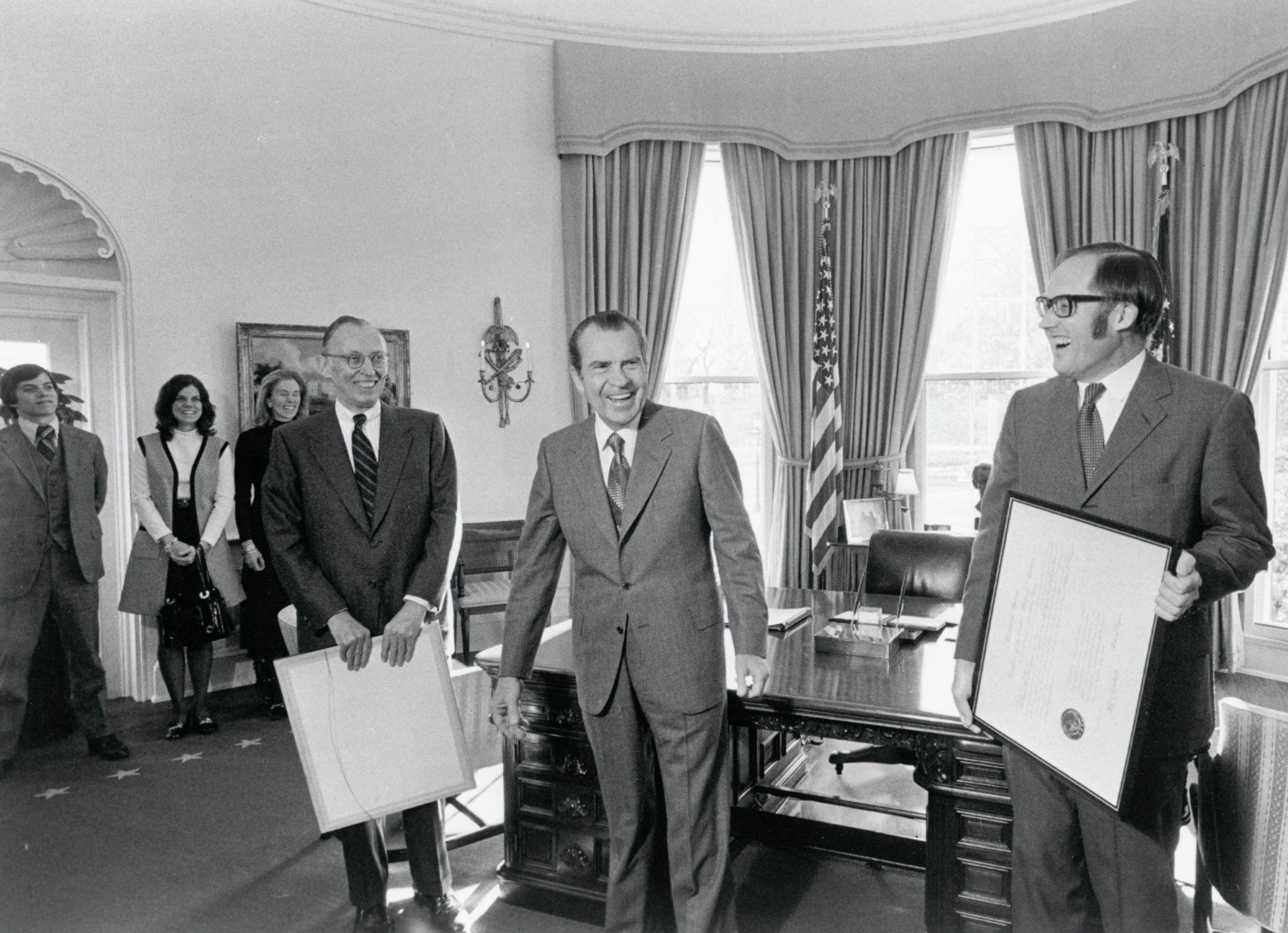 3. President Nixon presents framed gifts to Supreme Court Justices Lewis Powell and William Rehnquist 12-22-71 (8108-08A) (1)
