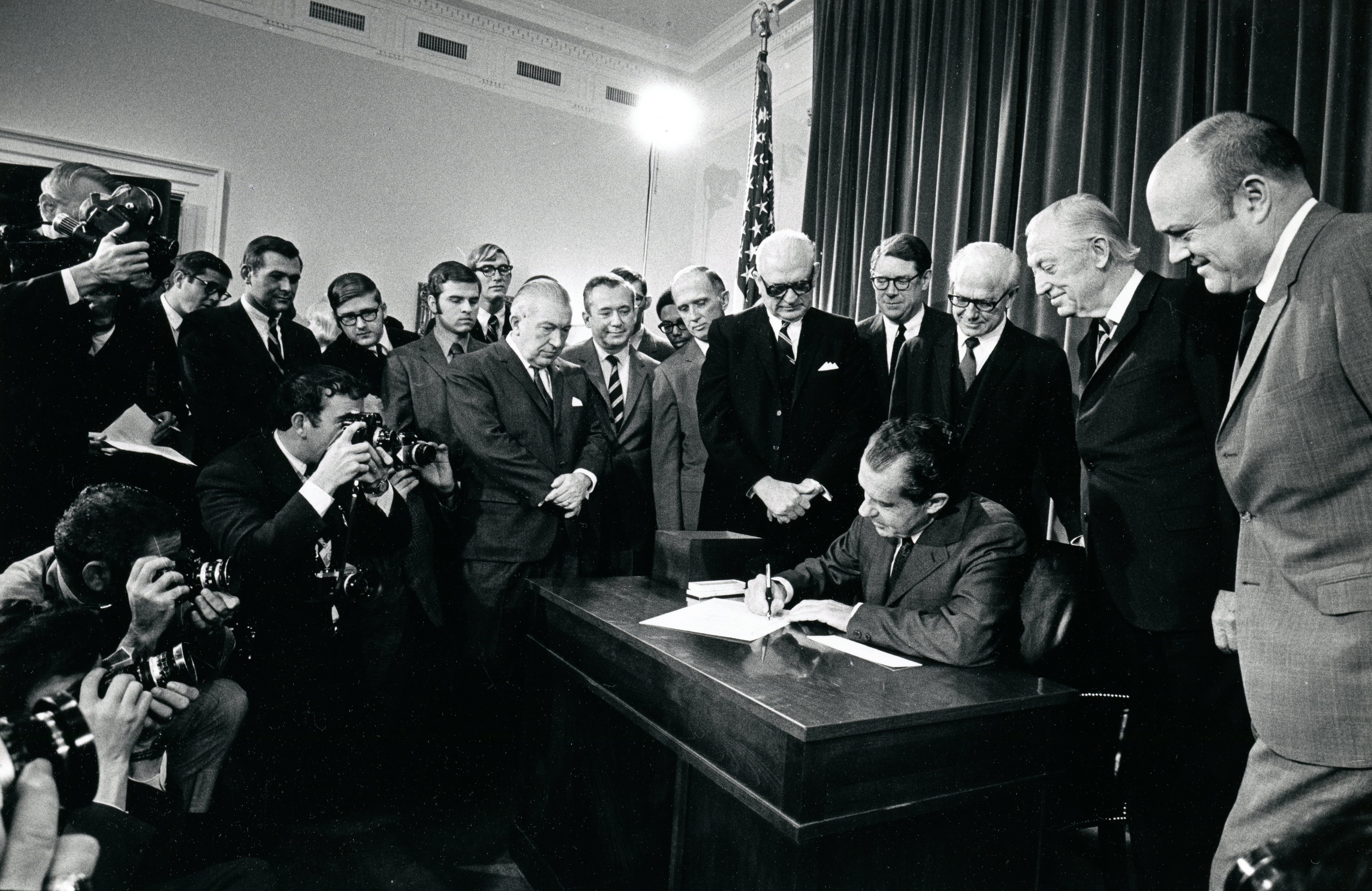 4a. President Nixon speaking to the press corps and signing an act to amend the Military Selective Services Act of 1967 Draft Lottery Bill 11-26-1969 2496-10A (1)